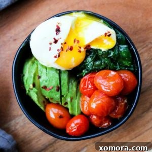 A close-up of the delicious Poached Eggs and Garlic Spinach recipe.