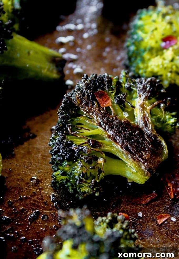 Fiery Roasted Broccoli 2 Crispy Spicy Roasted Broccoli on a baking sheet