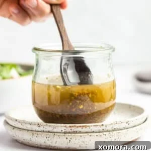 A close-up shot of the finished Easy Homemade Italian Dressing in a jar.