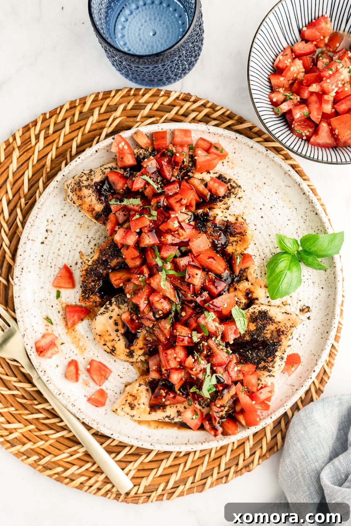 Vibrant Bruschetta Chicken 4 Balsamic vinegar simmering in a small saucepan to create a glaze.