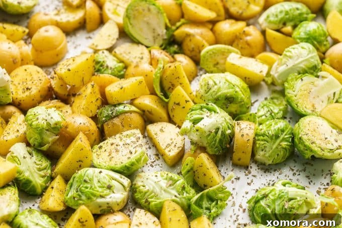 Close-up of roasted potatoes and brussels sprouts with pesto
