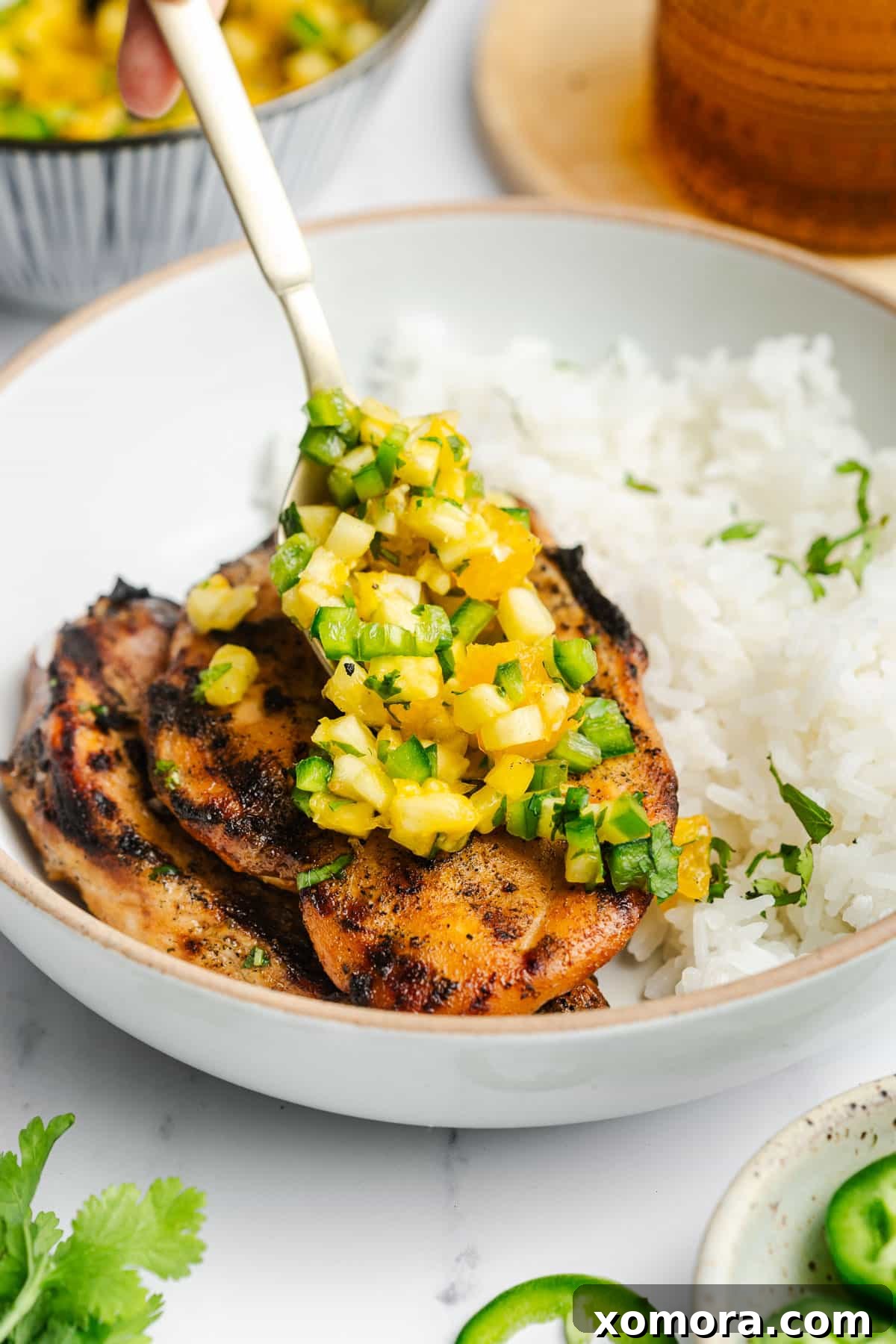 Exotic Flame-Grilled Chicken with Tropical Fruit Salsa 5 A delicious serving of tropical salsa grilled chicken, beautifully plated with the vibrant fruit salsa on top, ready for a delightful meal.
