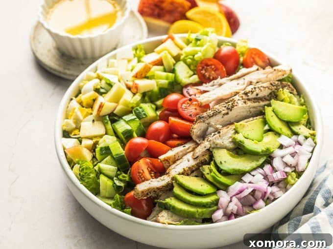 An overhead shot of a prepared Lemon Chicken Cobb Salad, ready to be served, highlighting the fresh, colorful ingredients.