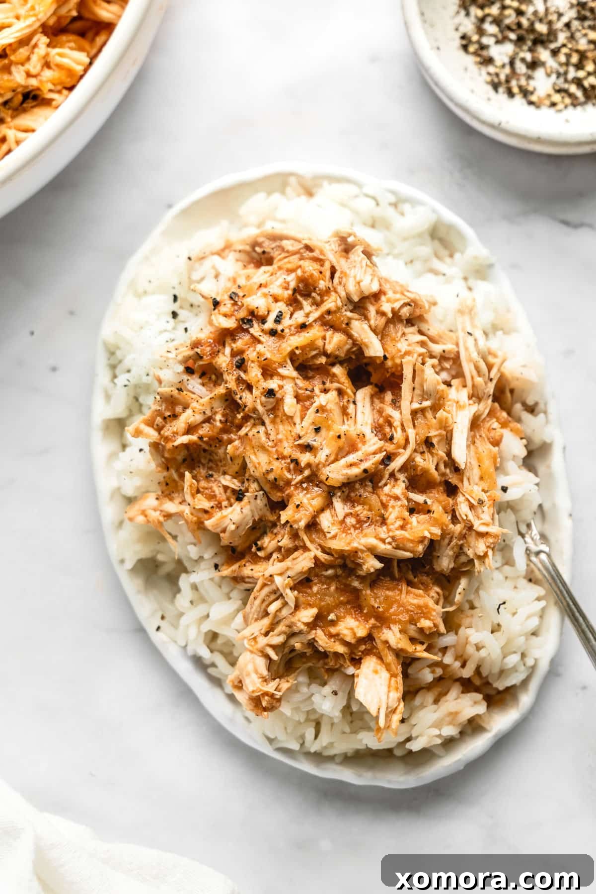 Slow Cooker Tropical Pulled Chicken 4 Close-up of shredded Slow Cooker Pineapple Chicken in a bowl, ready to be served.