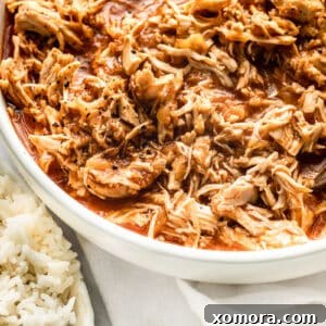 Slow Cooker Shredded Pineapple Chicken with a circular crop.