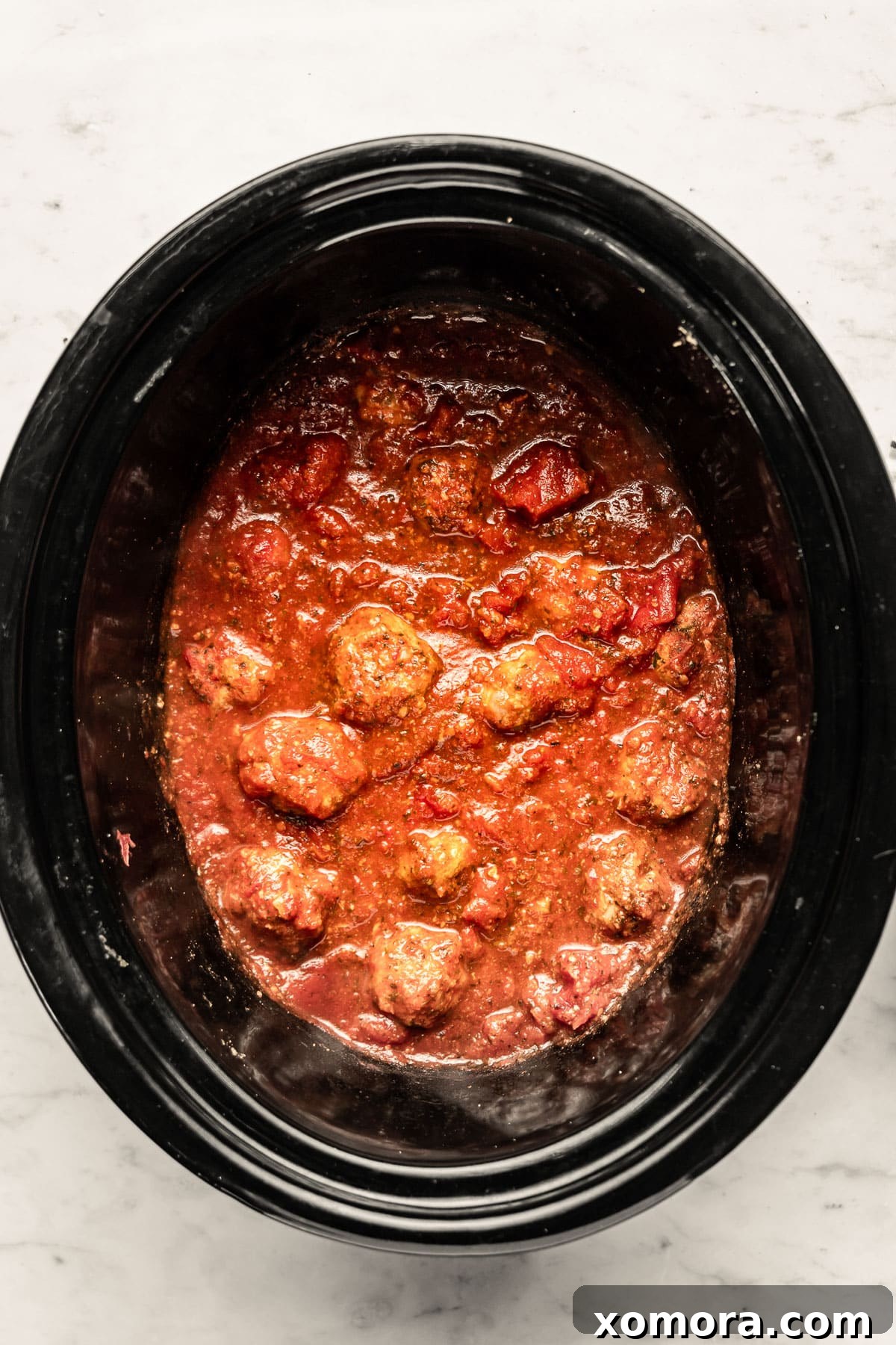 Mouthwatering Slow Cooker Turkey Meatballs in Classic Marinara 3 Close-up of freshly chopped parsley and basil, essential herbs for turkey meatballs.