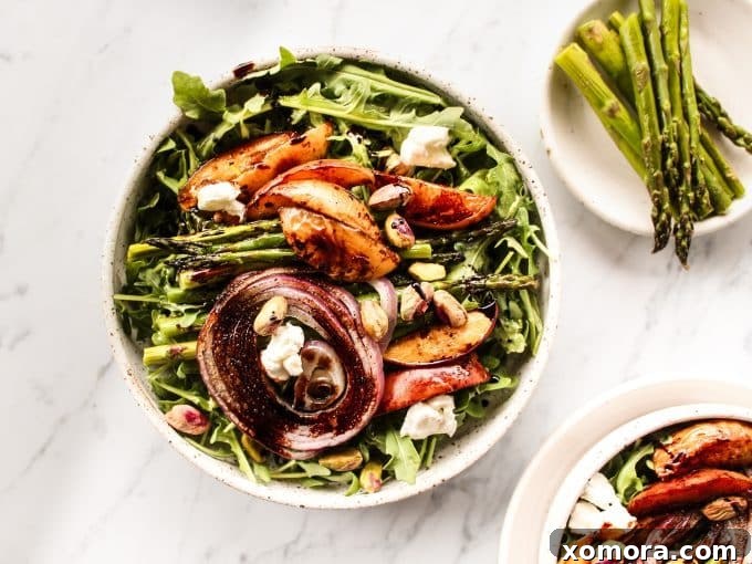 Summer Peach Arugula with Balsamic 5 A serving of Balsamic Peach Arugula Salad, showcasing the colorful ingredients and a generous drizzle of balsamic glaze.