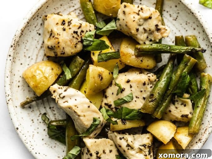 Deliciously roasted green beans, bright and tender, nestled on a baking sheet.