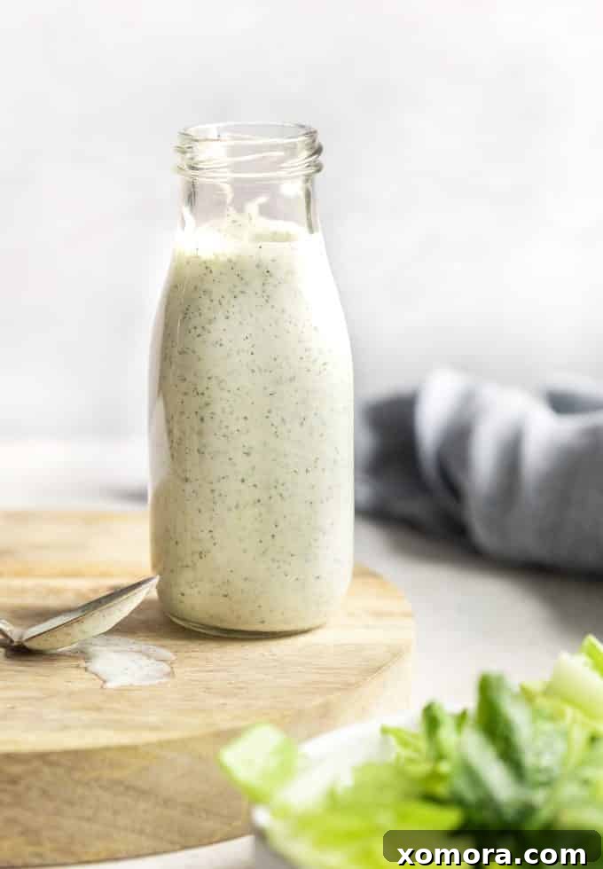 Plant-Based Ranch Dressing and Dip 5 A bowl of Dairy-Free Ranch Dressing and dip with fresh vegetables like carrots and celery sticks ready for dipping.
