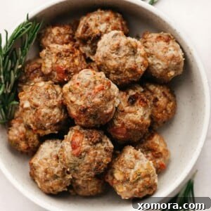 A beautifully styled image of the baked turkey apple breakfast meatballs, ready to eat.