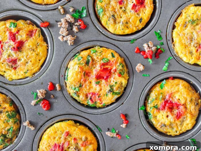 Savory Turkey Pizza Egg Cups 5 A stack of Turkey Pizza Egg Muffins on a plate next to a glass of orange juice, ready for a healthy breakfast.