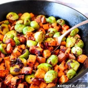 Sweet Potato Bacon Hash in a white bowl, ready to be served.