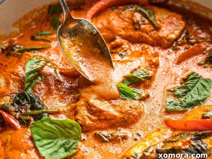 Creamy Red Pepper Chicken Sauté 4 The finished Sautéed Chicken in Creamy Red Pepper Sauce in a skillet with spinach.