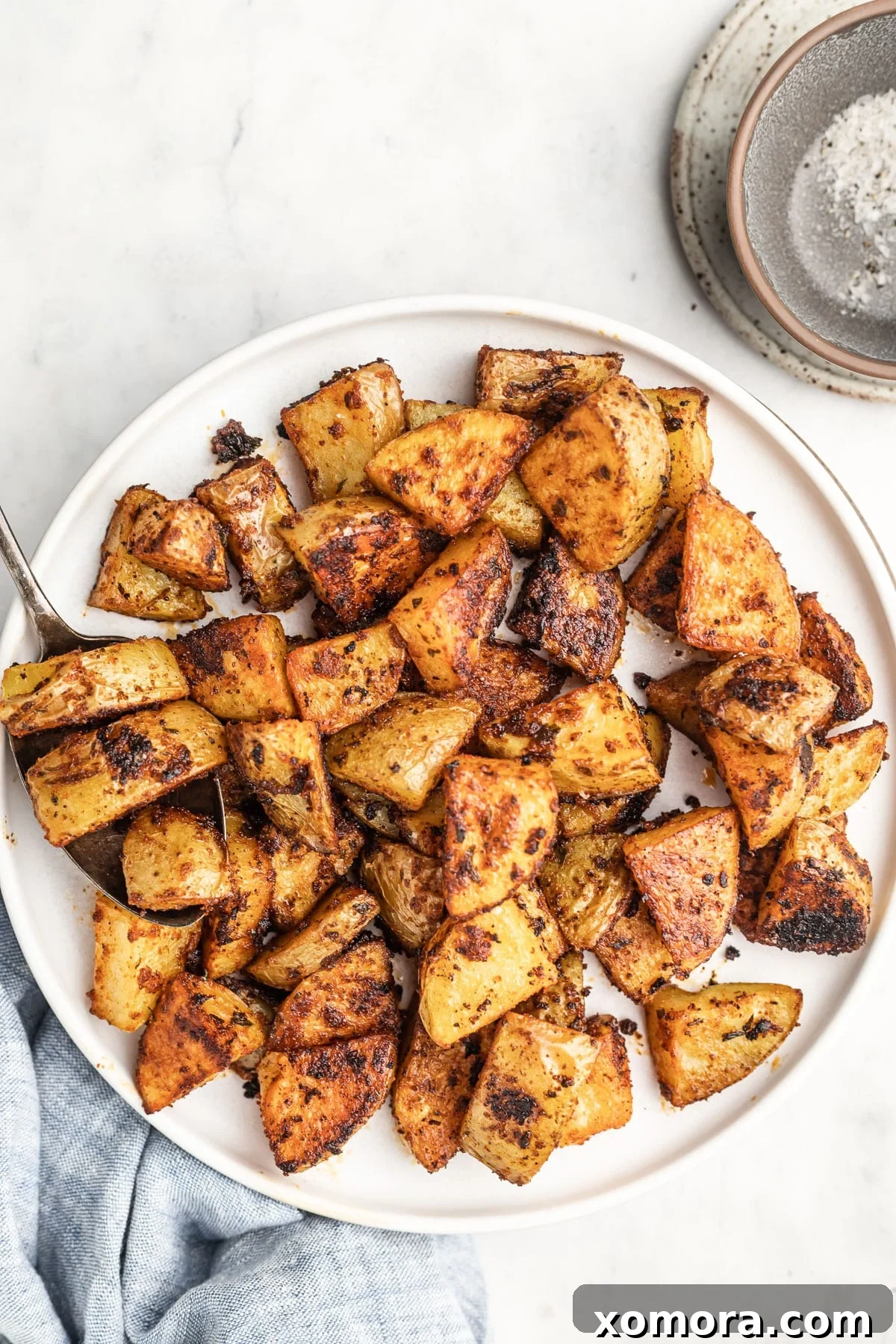 Golden Crispy Oven Potatoes 6 Crispy roasted potatoes served alongside a main dish.