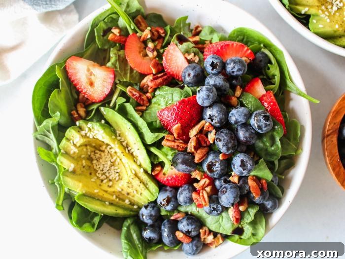 Vibrant Berry Avocado Salad 4 Another perspective of the ready-to-eat berry avocado salad, highlighting its freshness and appeal.