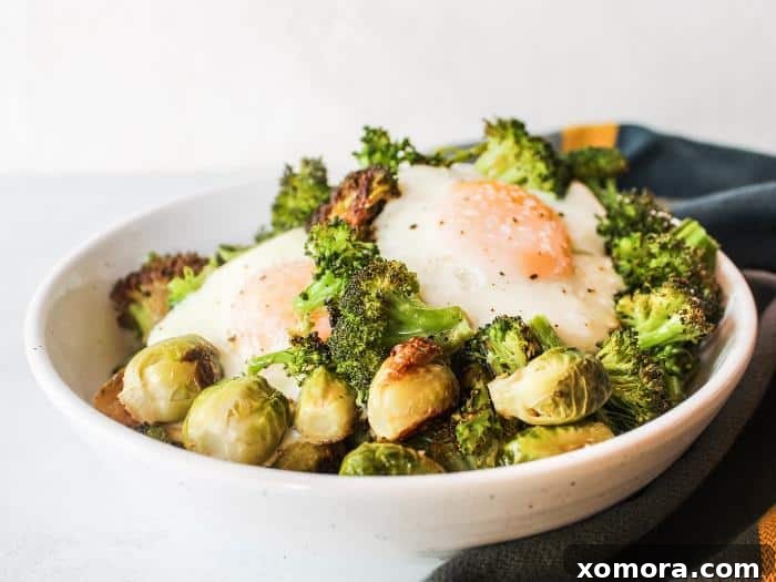 One Pan Veggie Breakfast Bowls 3 Close-up shot of Sheet Pan Veggie Breakfast Bowl ingredients, including fresh broccoli florets, green beans, and brussels sprouts, ready for roasting.