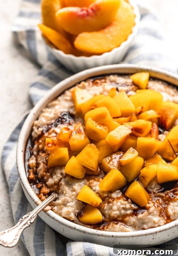 A close-up of a bowl of healthy peach steel cut oats, ready to be enjoyed.