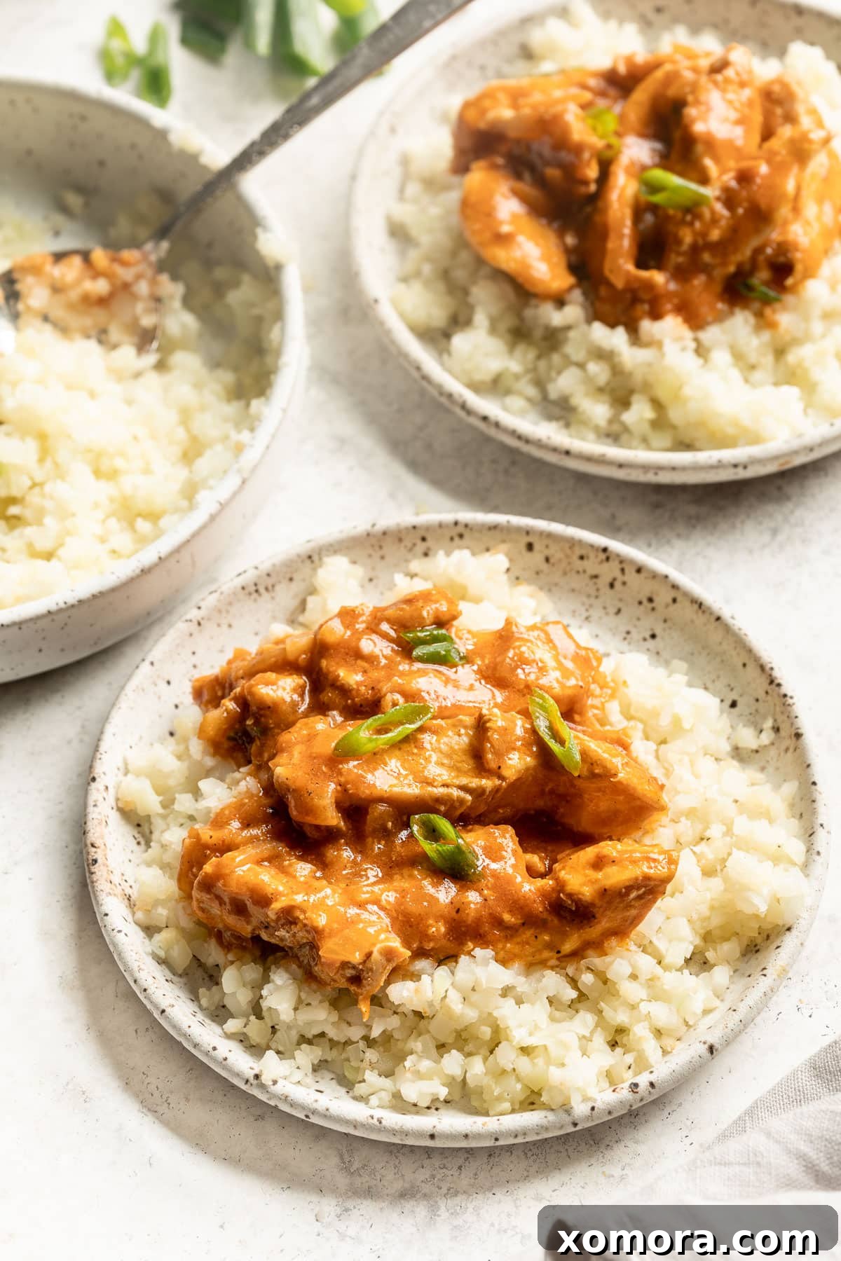 Diced chicken pieces simmering in the rich, golden curry sauce.