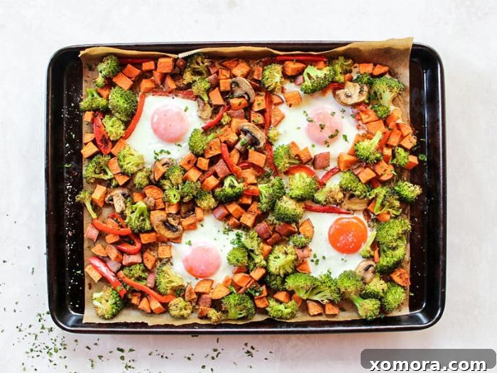 Farmhouse Fresh Sheet Pan Breakfast 3 Close-up of roasted sweet potatoes, broccoli, bell peppers, and mushrooms on a sheet pan