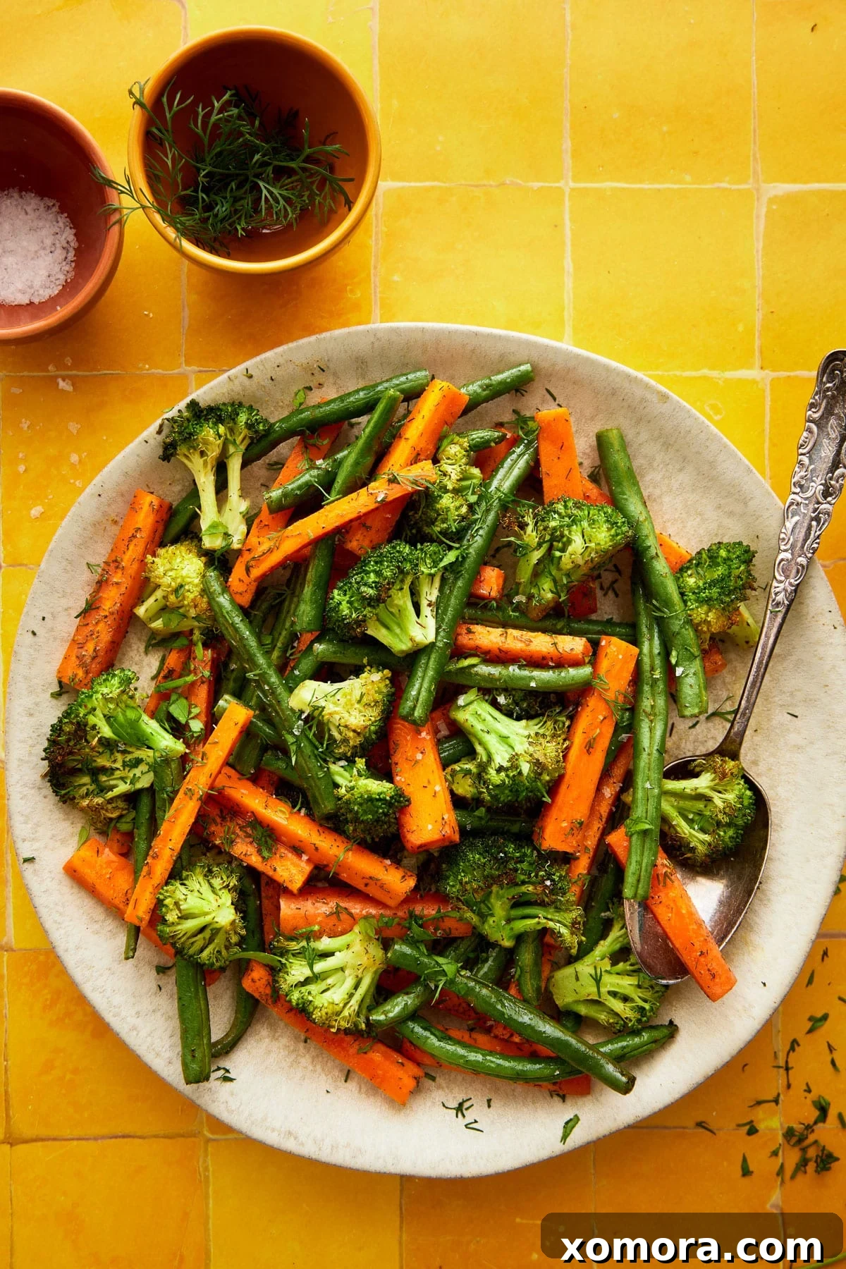 Ranch Roasted Vegetable Medley 6 A bowl of freshly roasted ranch vegetables, ready to be served, garnished with fresh herbs