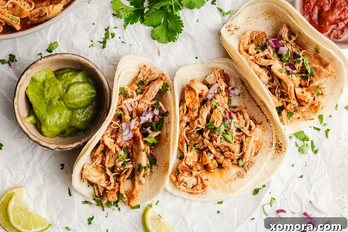 Effortless Instant Pot Shredded Salsa Chicken 6 A vibrant and colorful taco salad topped with Instant Pot Shredded Salsa Chicken.