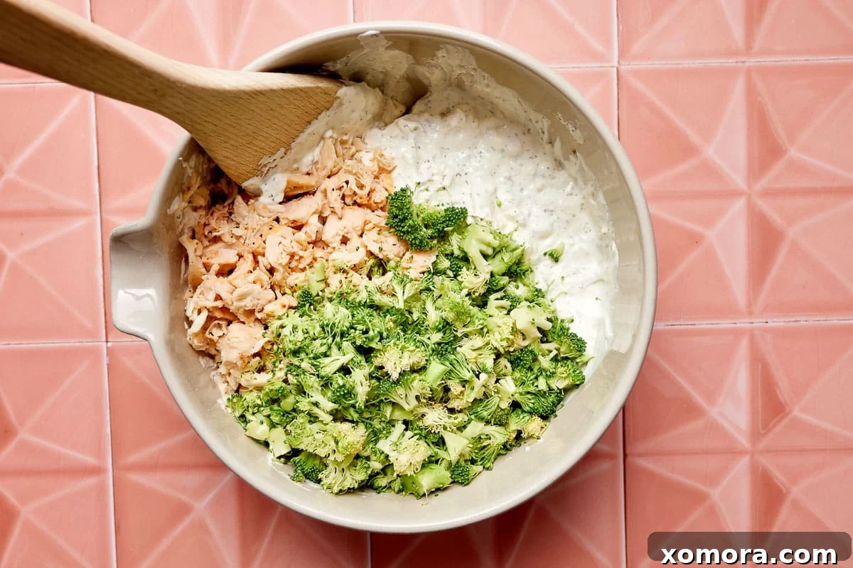 Creamy Chicken Broccoli Crescent Bake 3 Close-up shot of the creamy chicken and broccoli filling mixture in a bowl, showcasing the rich texture before being added to the casserole.