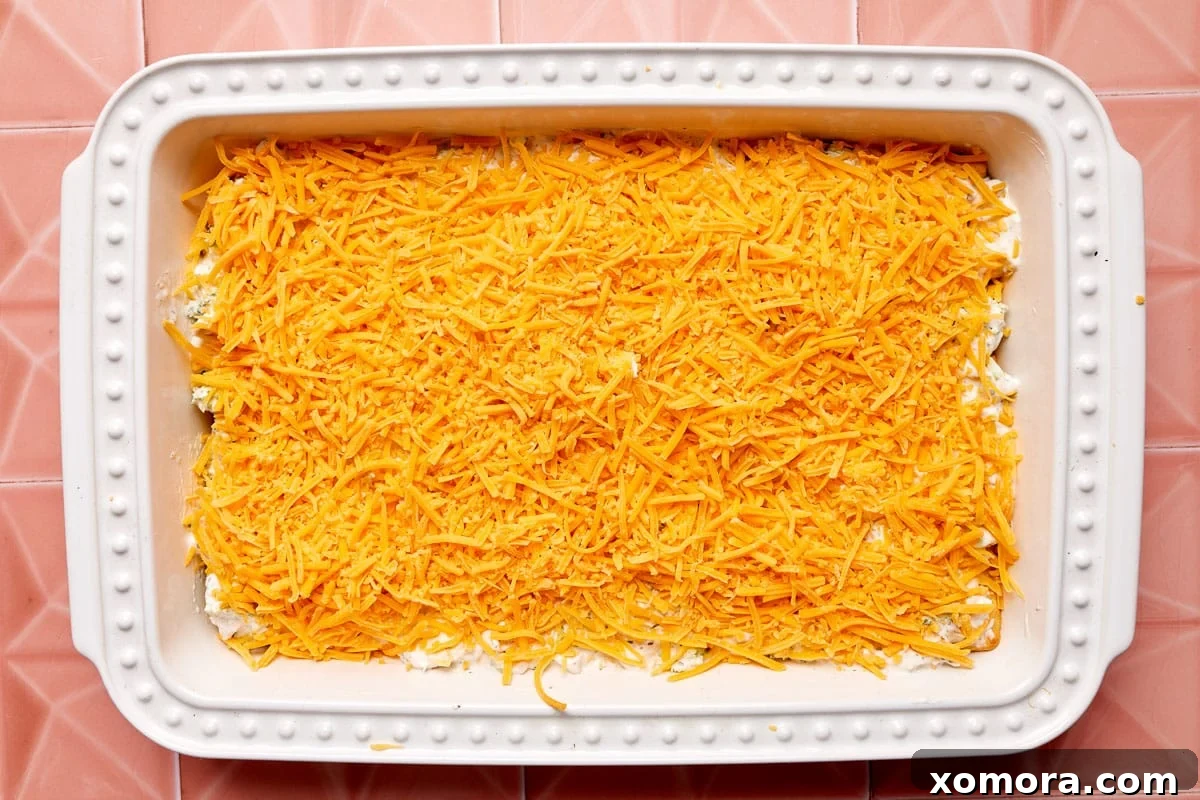 Creamy Chicken Broccoli Crescent Bake 6 A perfectly sliced portion of creamy chicken and broccoli crescent roll casserole, displaying its layers, ready to be served.