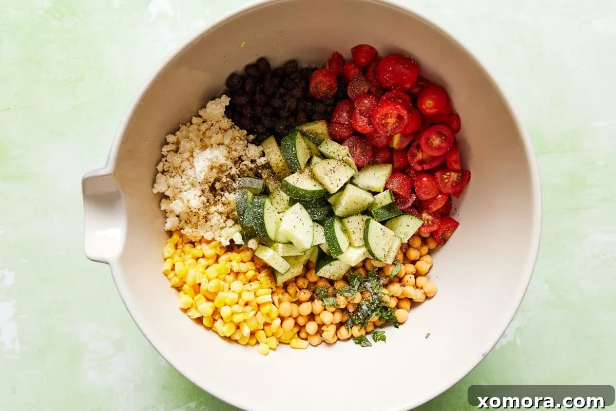 15-Minute Mediterranean Chickpea Salad with Fresh Herbs 3 Bowl with chickpeas, tomatoes, and basil